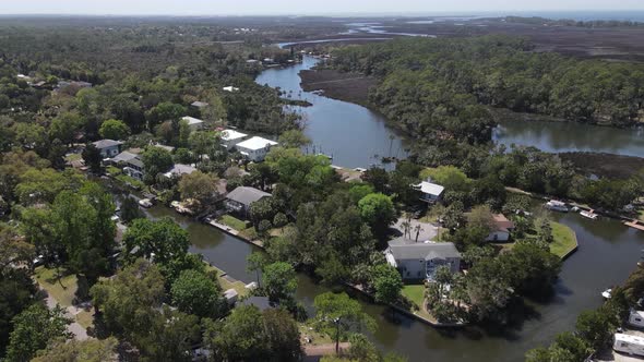 aerial of homes on the canals at the start of the wider portion of the Weeki Wachee River in Florida