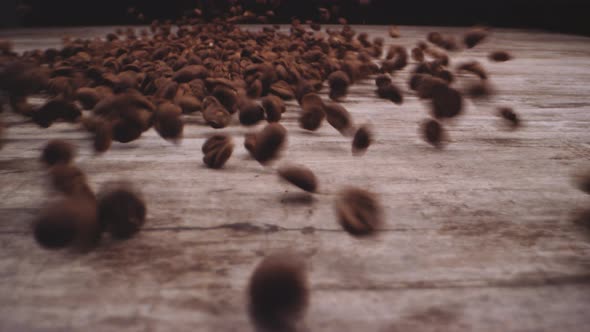 Roasted Coffee Beans Dropped Onto Wood