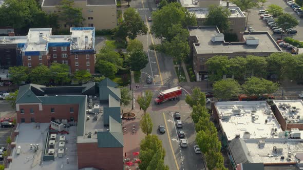 Aerial View of Cars Driving by a Street Intersection in Garden City Long Island