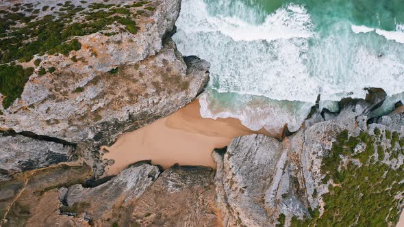 Aerial Circling Footage of Surreal Hidden Praia Do Cavalo Beach in Sintra Portugal
