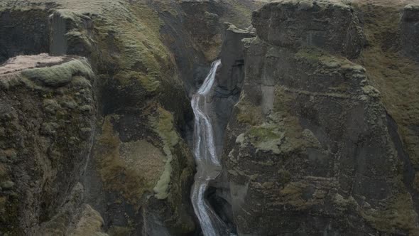 Stunning aerial view of Fjadrargljufur canyon and shallow creek flowing. Iceland