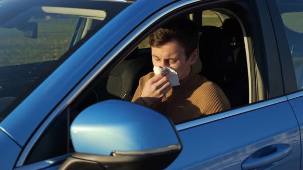 Driver Blows Nose Into Paper Napkin Sitting Inside Car