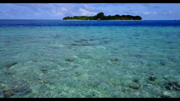 Aerial panorama of tropical tourist beach break by blue sea with white sandy background of journey n