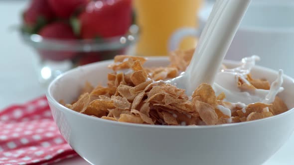 Milk pouring into cereal bowl in slow motion; shot on Phantom Flex 4K at 1000 fps alt