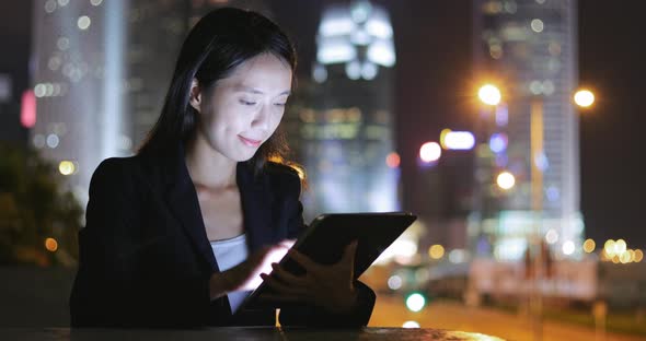 Woman use of cellphone at night 