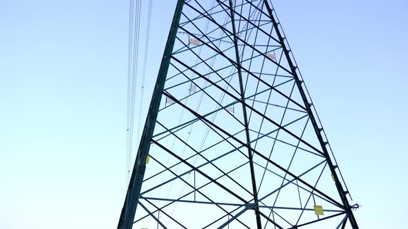 Tower with Electric Power Transmission Lines in Green Field