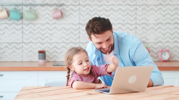 Young family with a child talking using a microphone and webcam