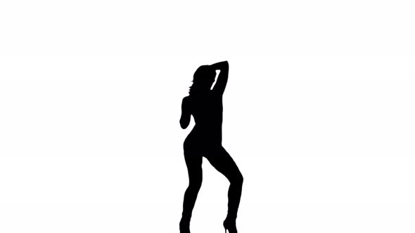 A Silhouette Woman Is Casually Dancing Against A White Background