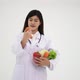 Woman nutritionist holding and showing many fresh vegetables and fruit - VideoHive Item for Sale
