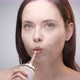 Woman with Long Hair Cleaning Teeth with Water Flosser - VideoHive Item for Sale