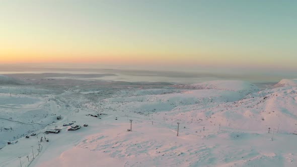 Aerial Shot of Sunrise in Winter Mountains