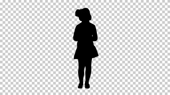 Silhouette Cute little girl looks in smartphone and writing alt