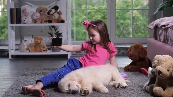 Adorable Little Girl Posing for Selfie on Floor