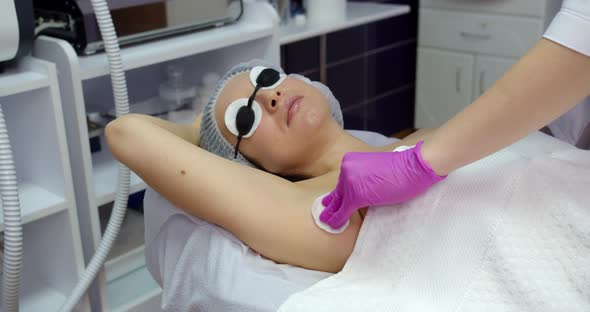 Armpit Disinfection Before Laser Hair Removal In A Beauty Salon. Body Care