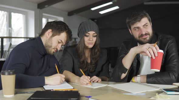 Team of Young Professionals Having a Meeting in a Creative Office