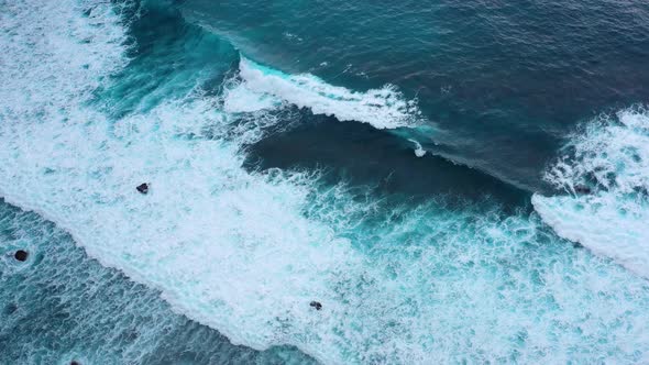 Indonesia, Waves and azure water as a background, View from drone at the ocean surface