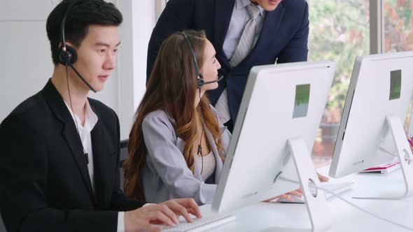 Business People Wearing Headset Working in Office