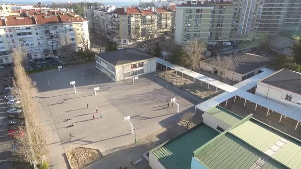 School with kids playing football