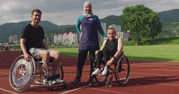 Hero Portrait Shot of Disabled Sport People Whit Female Trainer Wearing Hijab After Training on