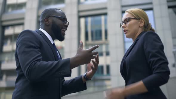 Businesswoman and Male Colleague Quarreling, Gender Equality, No Discrimination