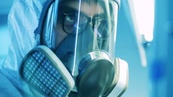 Face of a Male Laboratory Worker Wearing a Hazmat Mask