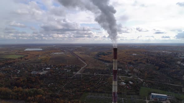 Power Plant Generating Heat and Electricity. High Pipes and Cooling Towers Are Visible. Aerial View.