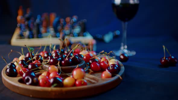 Close Up of Compartmental Dish with Different Varieties of Sweet Cherries on Table