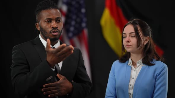 Portrait of Confident African American Man Talking As Caucasian Woman Shaking Head Yes at