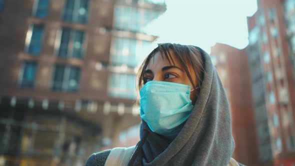 Woman in Hood and Medical Protection Face Mask for Prevention Coronavirus