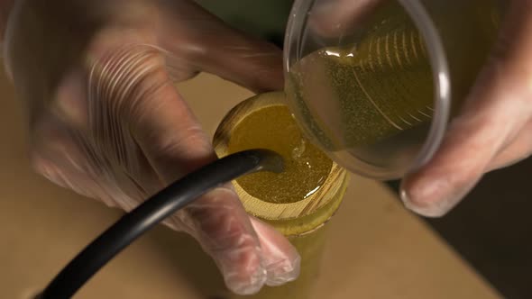 Pouring Epoxy Resin Into Bamboo