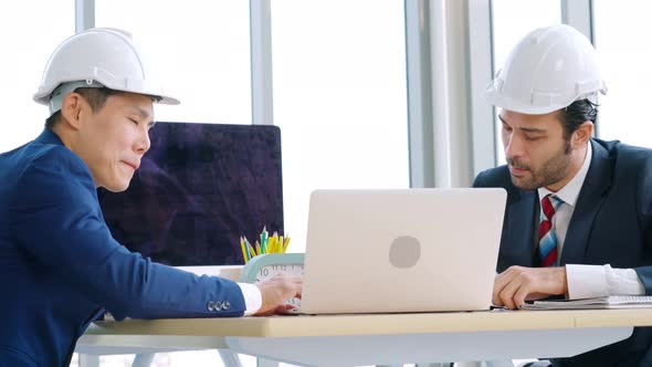 Engineer and Architect Meeting at Office Table