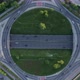 Aerial drone view of a multi-level highway crossroad with moving cars at sunset. Cars are moving alo - VideoHive Item for Sale