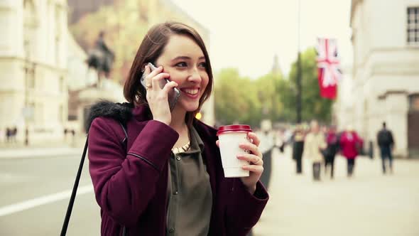 Young woman in London talking on the phone