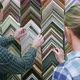 Young Couple Customer Looking for Frame for Picture in Atelier - VideoHive Item for Sale