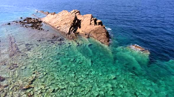 Small Islet Island Formed by the Accumulation of Rock Deposits Atop a Reef in the Sea