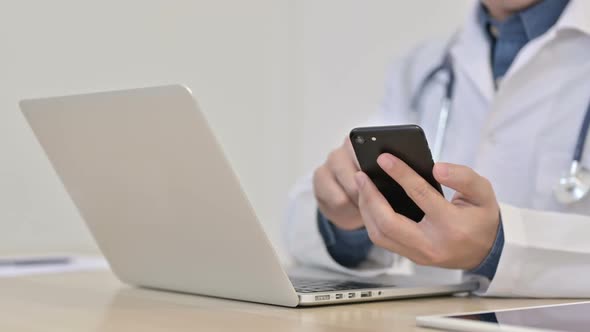 Doctor Using Smartphone in Clinic