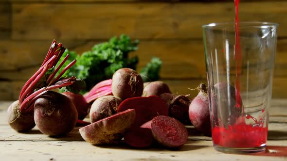 Radish with radish juice pouring into glass 4k