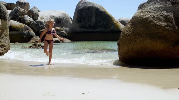 Girl running on water in the beach 4k