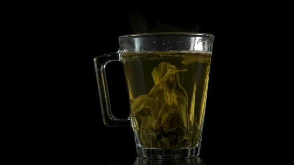 Tea leaves in a transparent cup. 