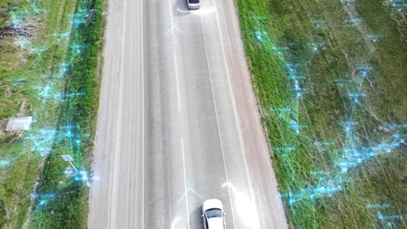 Aerial View From Drone Above Cars Driving Along Empty Countryside Road on Sunny Day