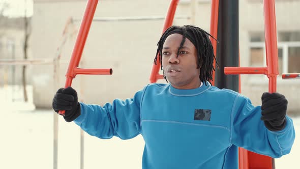 African American Man Footballer Warming Up on Sports Ground