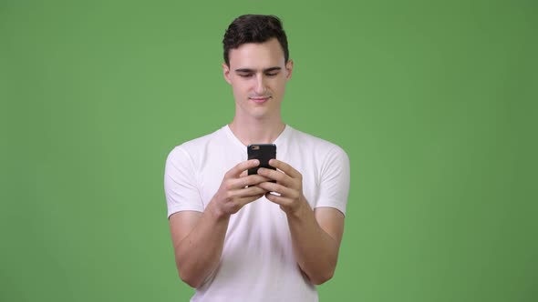 Young Handsome Man Using Phone
