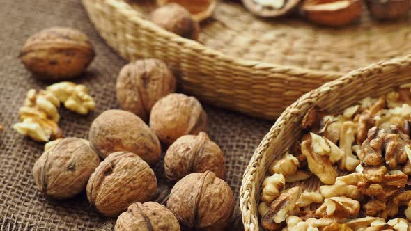 Walnuts on rustic natural burlap, Walnut kernels in wicker basket, Walnut background