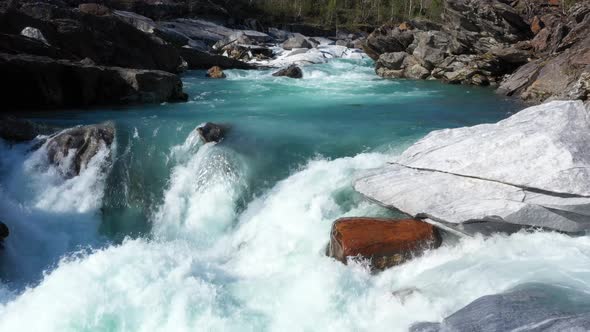 Fly above the surface of a mountain river Glomaga,Marmorslottet , Mo i Rana,Norway