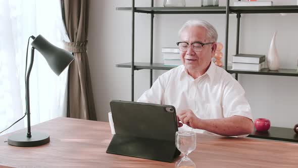 Middle-aged male chatting via video link with longtime friends. Accessibility and digital inclusion