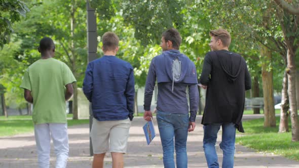 Students of College Walking Together on Campus