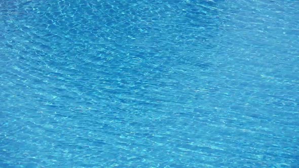 Background of Rippled Pattern of Clean Water Wave in Blue Swimming Pool