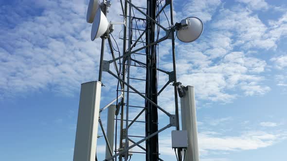 Telecommunications tower carrying broadcasting antennas for 3G, 4G and 5G cellular networks.