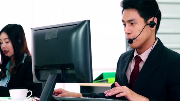 Business People Wearing Headset Working in Office