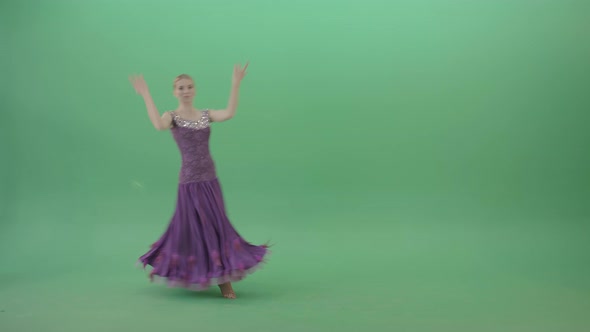 Blonde Dancer Woman In Glittering Purple Dress Spins Elegantly On Green Screen